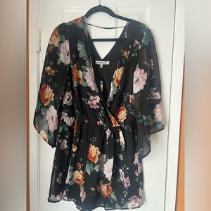 Cute flower print romper.  Never worn because it was too small.